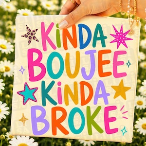 May include: A square canvas with the words "KINDA BOUEE KINDA BROKE" in bright, colorful letters. The text is in a playful font with star and diamond accents. The background is a light cream color.