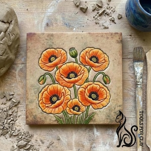 May include: Square ceramic tile with a hand-painted design of orange poppies with black centres and green stems. The flowers are set against a mottled, tan background. The tile is a decorative piece, possibly for home decor.