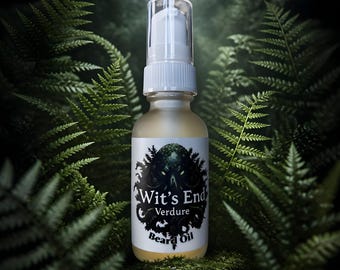 May include: A clear glass bottle of beard oil with a white pump dispenser and a white label. The label features a black graphic of a tentacled creature and the text Wit's End Verdure Beard Oil in a black serif font on a white background.