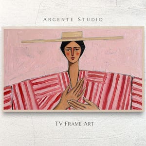 Op de afbeelding: Abstract schilderij van een persoon met een hoed en een gestreepte jurk. Het kunstwerk heeft een roze achtergrond met de tekst "ARGENTE STUDIO" en "TV FRAME ART". Het gezicht van de persoon is geschilderd in rode en bruine tinten.