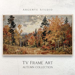 Op de afbeelding: Een rechthoekig landschapsschilderij met een herfstbos met hoge dennenbomen en loofbomen met oranje, geel en rood gebladerte. De tekst ARGENTE STUDIO, TV FRAME ART en AUTUMN COLLECTION staat boven en onder de afbeelding gedrukt.