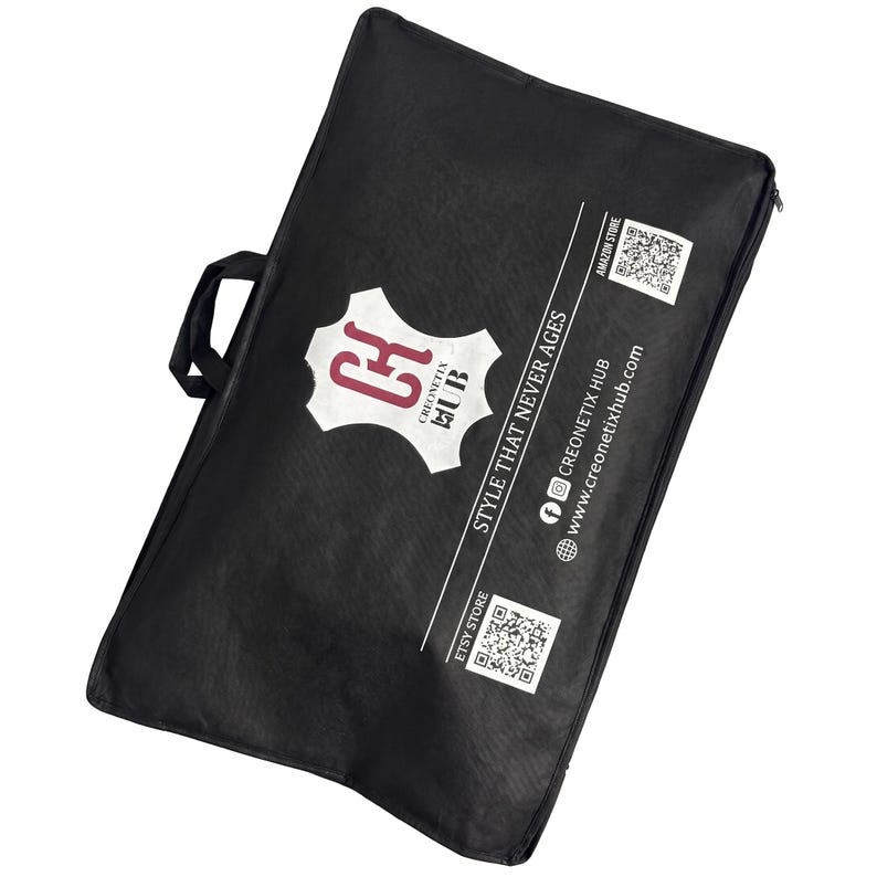 May include: A black rectangular garment bag with two handles, featuring a white logo with the text CK CREONETIX HUB, the slogan STYLE THAT NEVER AGES, social media icons, a website address, and two QR codes labelled AMAZON STORE and ETSY STORE.