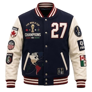 May include: A navy blue varsity jacket with cream-colored sleeves, featuring the text FIFA WORLD CUP CHAMPIONS CANADA USA MEXICO, the number 27, a world map graphic, and various embroidered patches representing the three host countries and FIFA.