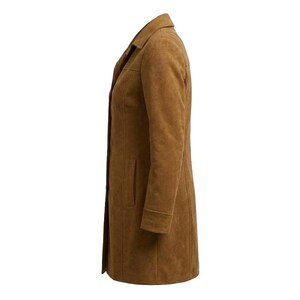 May include: A tan-coloured coat with a smooth, matte texture, featuring a classic collar, long sleeves with cuffs, and a straight hemline. The coat is shown from a side profile, displaying a vertical seam construction and a clean, structured silhouette.