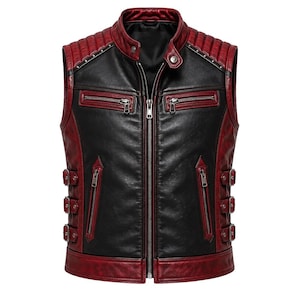May include: A sleeveless waistcoat featuring a black centre panel and deep red side panels with a quilted shoulder design. The garment includes a central zip, two chest zip pockets, two lower vertical zip pockets, and three side buckle straps.