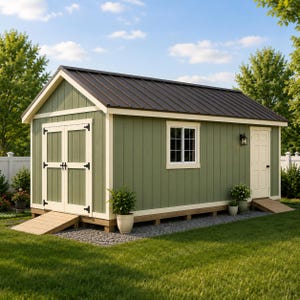 May include: A sage green storage shed with a dark brown metal roof, white trim, and double doors. It features a single window with white grid panes, a side entry door, and two wooden ramps leading to the entrances, set on a gravel foundation.