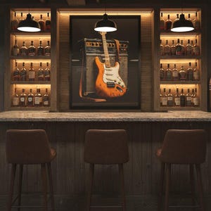 May include: A home bar with a rustic wood design. The bar features a framed image of an orange electric guitar and amplifier. Shelves on either side display bottles of liquor. Three brown leather bar stools are in front of the bar.