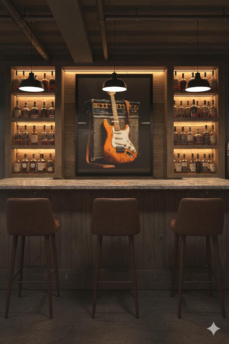 May include: A home bar with a rustic wood design. The bar features a framed image of an orange electric guitar and amplifier. Shelves on either side display bottles of liquor. Three brown leather bar stools are in front of the bar.