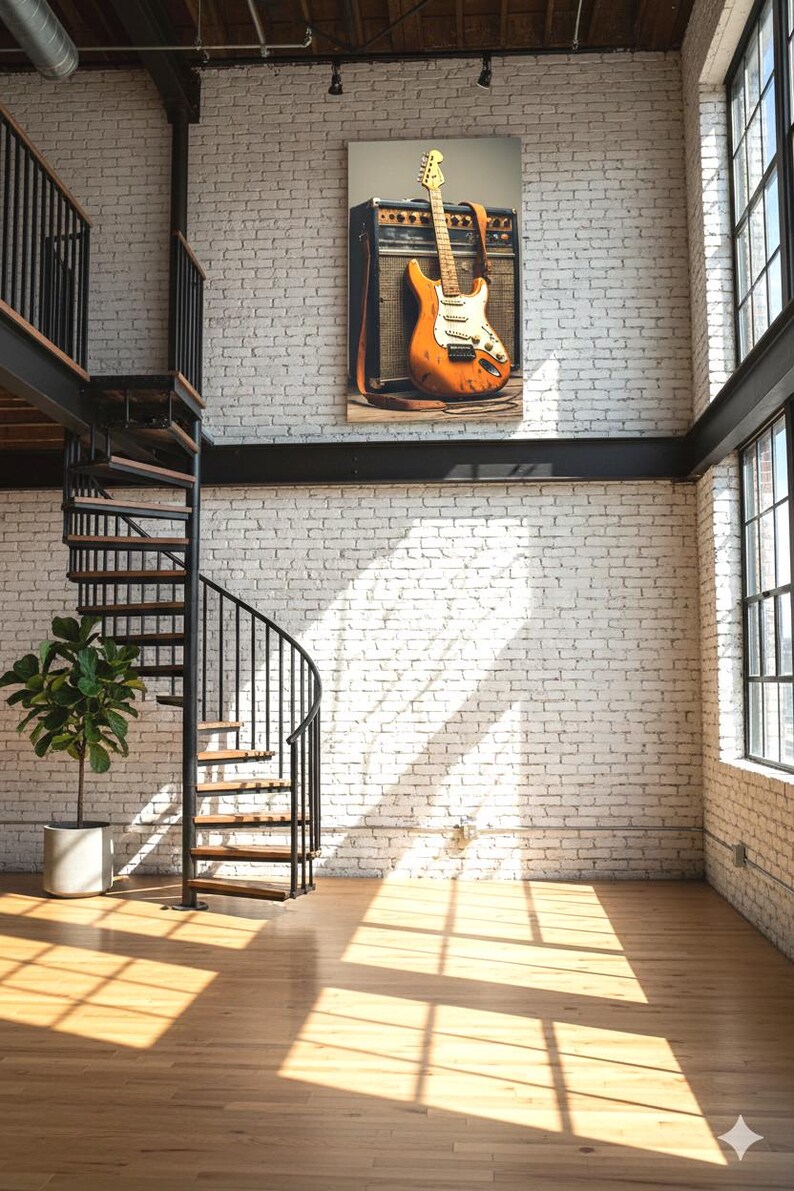 May include: An orange electric guitar with a white pickguard leans against a vintage amplifier, mounted on a white brick wall. The room features a spiral staircase, hardwood floors, and large windows, creating a modern, industrial aesthetic.