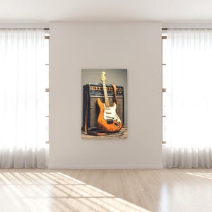 May include: An orange electric guitar with a white pickguard and a brown strap leans against a black and brown amplifier. The guitar has a light-colored neck and headstock. The image is a canvas print.