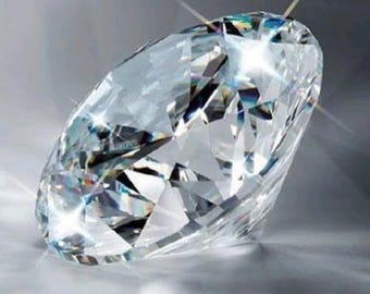 May include: A large, clear diamond with multiple facets, reflecting light and creating a sparkling effect. The gemstone is set against a soft, gray background, highlighting its brilliance. The diamond's cut is round, and it appears to be a high-quality piece of jewelry.