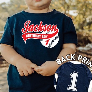 Baby boy 1st birthday baseball shirt, navy shirt with name in red script font and baseball with a number 1 printed on the back of the shirt