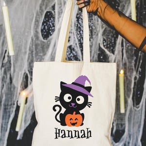 Halloween Trick or Treat tote bag with a cute black cat wearing purple hat and a pumpkin, personalized with kids name is perfect for Trick or treating or Halloween gift