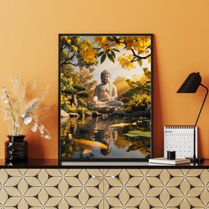 May include: Framed artwork depicting a serene Buddha statue seated in meditation by a pond. The scene includes koi fish, yellow flowers, and birds, creating a tranquil and spiritual atmosphere. The artwork is displayed on a black surface.