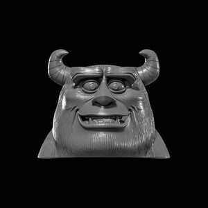 May include: A gray, three-dimensional sculpture of a friendly monster's head. The monster has large eyes, a wide smile, and two curved horns. The sculpture is set against a black background.