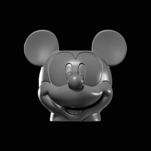 May include: A gray, three-dimensional sculpture of Mickey Mouse's head and face. The sculpture features large, rounded ears, a smiling expression, and a prominent nose. The background is solid black.