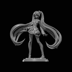 May include: A grayscale figurine of a female anime character with long flowing hair and a detailed outfit. The figure is standing on a rectangular base, with arms outstretched. The overall design is intricate and detailed.