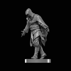 May include: A grayscale figurine of a cloaked figure with a hood, cape, and detailed clothing. The figure is in a dynamic pose with outstretched arms, standing on a rectangular base against a black background. The figurine appears to be a fantasy character.