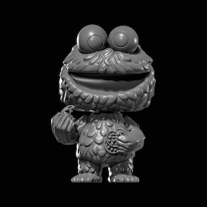 Puede incluir: Figura en escala de grises del personaje de Cookie Monster de Barrio Sésamo. La figura tiene ojos grandes y redondos, una boca muy abierta y un cuerpo peludo. Sostiene una bolsa en una mano y una galleta en la otra.