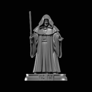 Peut inclure: Figurine grise d'une figure encapuchonnée tenant un sabre laser. La figurine repose sur une base rectangulaire avec des détails gravés. Le fond est noir uni.