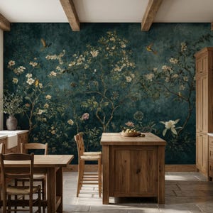 May include: A kitchen with wooden cabinets, a central island, and a dining table. The focal point is a dark teal mural with a floral and bird design. The room has a rustic, natural aesthetic with exposed wooden beams.