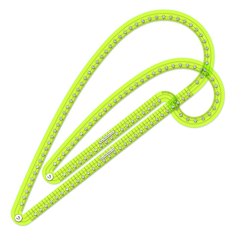 May include: A bright yellow plastic sewing ruler with curved edges and markings in inches. The ruler is designed for creating curved lines and shapes.