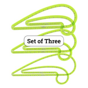 May include: A set of three neon green curved rulers with measurement markings. The rulers are in a unique shape, with the text "Set of Three" in a white box.
