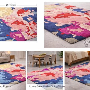 May include: A rectangular rug with a colorful abstract design. The rug is 5 feet wide and 7 feet long, featuring shades of blue, pink, red, and yellow. The rug is described as soft, durable, and easy to clean.