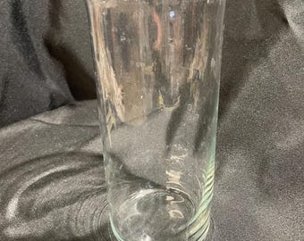 Vintage clear glass vase, featuring a flanged rim and standing approximately 9 inches tall.