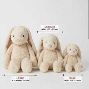 May include: Three plush bunny toys in varying sizes. The largest is 11 inches wide, 19 inches tall, and 8 inches deep. The medium bunny is 8 inches wide, 14 inches tall, and 5 inches deep. The smallest is 5 inches wide, 10 inches tall, and 4 inches deep.