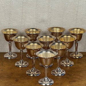 May include: A rustic wooden sign with the text "Welcome to our home" in white lettering. The sign has a distressed finish and a simple, inviting design, ideal for entryway decor.