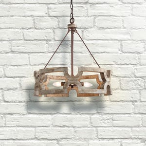 May include: A rustic, wooden chandelier with a circular design. The light fixture has a distressed, whitewashed finish and features two light bulbs. It hangs from a chain and metal supports against a white brick wall.