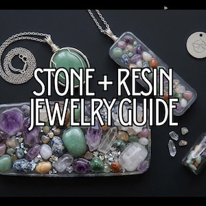 May include: Two silver chain necklaces with stone and resin pendants, a rectangular resin block filled with assorted colorful tumbled stones, and a small glass bottle with a cork stopper containing tiny stones, with the text STONE + RESIN JEWELRY GUIDE.
