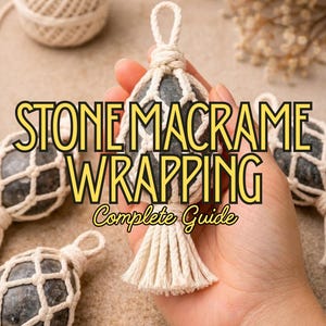 May include: A hand holds a gray stone wrapped in a macrame net, with a tassel. The text "STONE MACRAME WRAPPING Complete Guide" is displayed in yellow. Other macrame-wrapped stones are visible in the background, along with a ball of twine.
