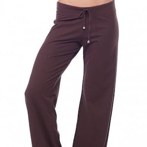 May include: A pair of brown wide-leg pants with a drawstring waist.