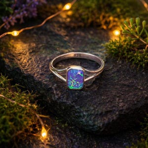 May include: A set of three ceramic mugs with a speckled, matte finish. The mugs are in shades of cream, light gray, and dark gray. Each mug has a simple, minimalist design, perfect for coffee or tea.