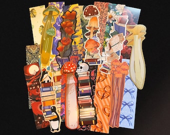 May include: A selection of illustrated bookmarks with diverse designs. The bookmarks display images of mushrooms, stacks of books, flowers, and a penguin. The colour scheme includes shades of red, orange, green, and blue.