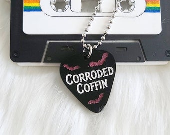 Corroded coffin with bats necklace