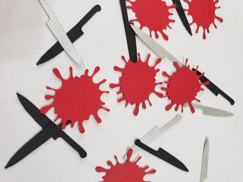 May include: A collection of red blood splatter and black and silver knives cutouts. These paper cutouts are perfect for Halloween party decorations.