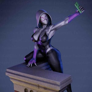 May include: A figurine of a female superhero in a black and silver bodysuit with purple accents, taking a selfie with a green phone. The figure is posed on a stone ledge, with a hooded mask and white eye details.