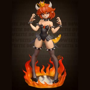 May include: A figurine of a character with orange hair, horns, and a crown, wearing a black outfit with spiked accents. The figure stands on a base of stylized flames. The text "LAZY DECAY" is visible.