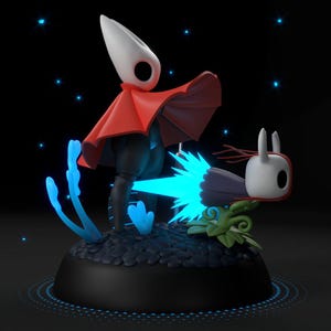Peut inclure: Figurine détaillée d'un personnage à tête blanche et cape rouge, sur une base noire. Accompagné d'une petite créature à tête blanche et d'une explosion d'énergie bleue. Accents bleus lumineux et fond sombre complètent la scène.