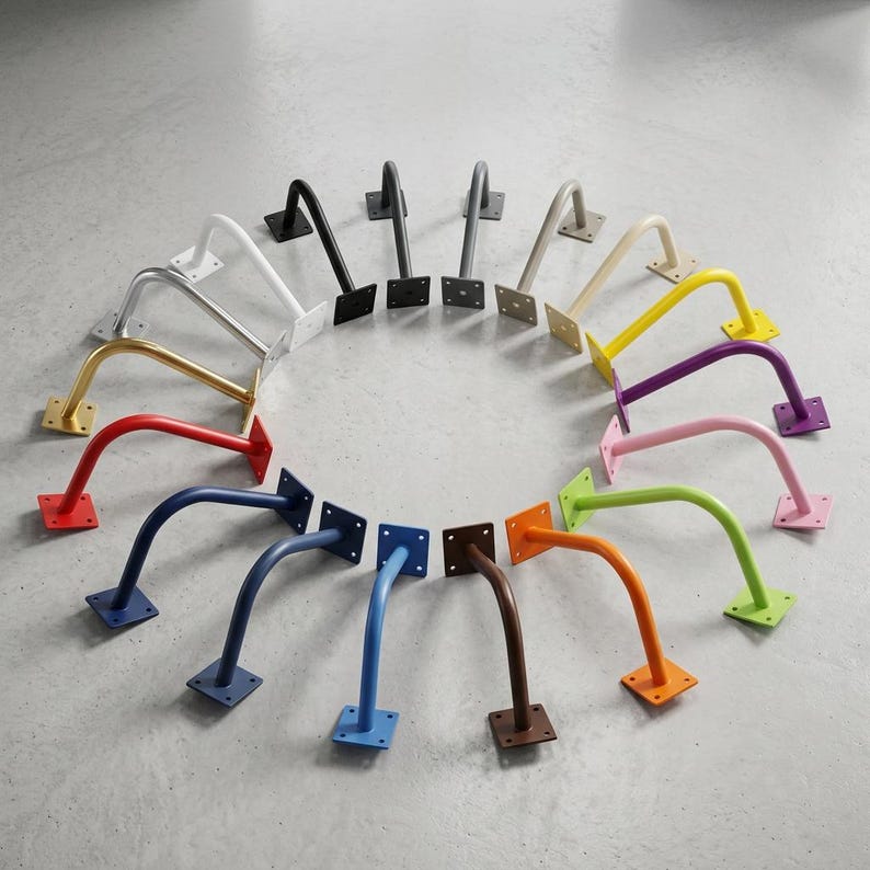 May include: A collection of metal shelf brackets arranged in a circular pattern. Each bracket features a curved arm and a square mounting plate with four screw holes. The set includes a variety of colors such as white, black, gray, gold, red, blue, orange, green, pink, purple, and yellow.
