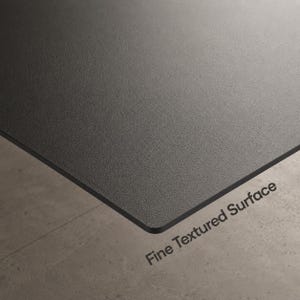 May include: A flat, rectangular panel featuring a dark charcoal gray color and a fine textured surface. The material has a matte finish with a consistent grain pattern across the entire top side. The text Fine Textured Surface is printed.
