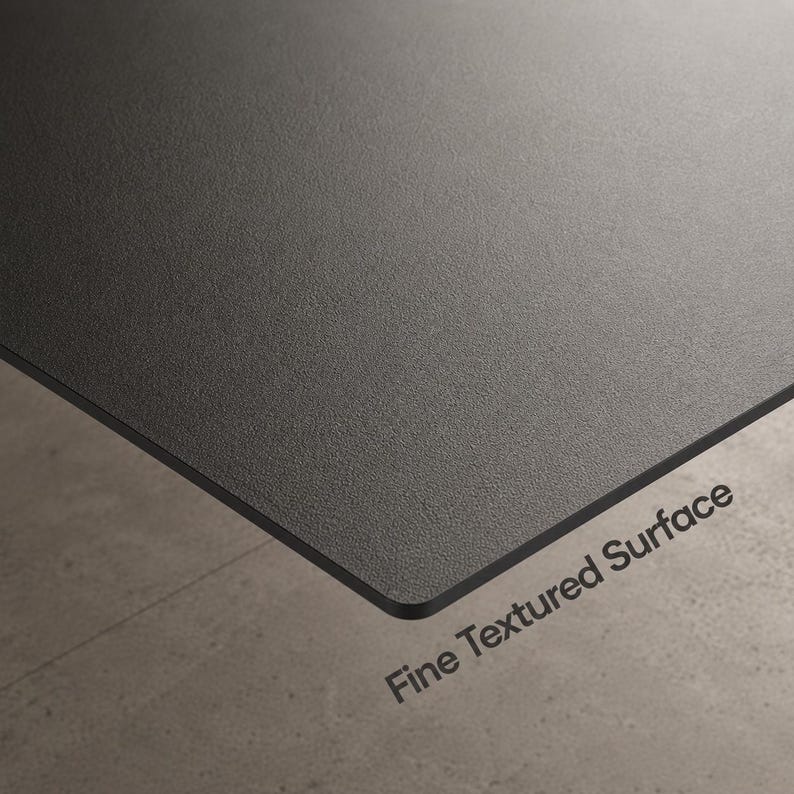 May include: A flat, rectangular panel featuring a dark charcoal gray color and a fine textured surface. The material has a matte finish with a consistent grain pattern across the entire top side. The text Fine Textured Surface is printed.