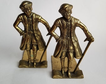 Solid brass bookends featuring colonial era man / made in England figural bookends