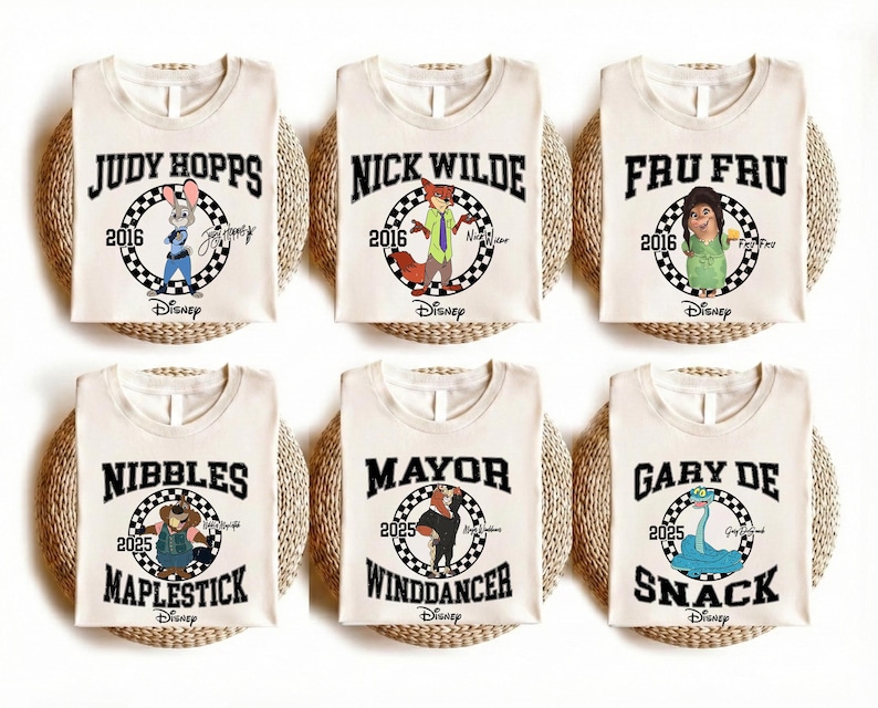 May include: Six off-white sleeveless shirts featuring Disney character graphics. Each shirt displays a name, a year, a checkered circle, and the Disney logo. Characters include Judy Hopps, Nick Wilde, Fru Fru, Nibbles Maplestick, Mayor Winddancer, and Gary De Snack.