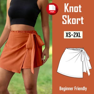 Puede incluir: Una falda envolvente naranja con un detalle de lazo. La imagen también incluye un icono PDF, el texto "Knot Skort XS-2XL" y un boceto de la falda. También son visibles las palabras "Beginner Friendly".