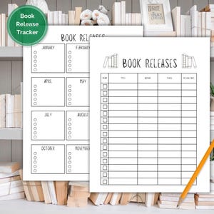 May include: Two white paper book release trackers with black text. One tracker is divided into months with checkboxes. The other has columns for title, author, series, and release date. A yellow pencil rests on the second tracker.