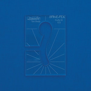 May include: A clear acrylic quilting template with the text "Westalee Design" and "Spin-E-Fex Curly-Q 5.5" printed on it. The template features a curved design with radiating lines and a curved cutout, set against a blue background.